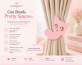 Pink cat-shaped curtain tieback with product details on a light pink background